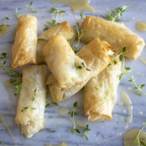 Baked Cacique® Queso Fresco Cheese Rolls with Honey and Thyme