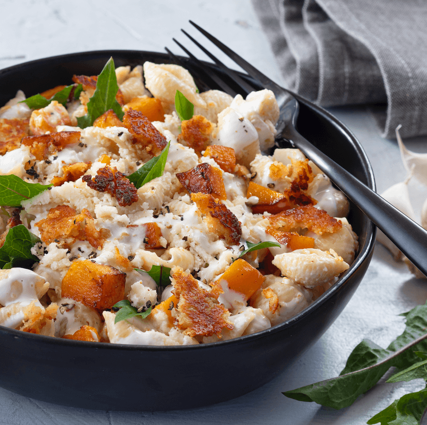 Pasta in Garlic Crema Sauce with Butternut Squash and Cotija Crisps