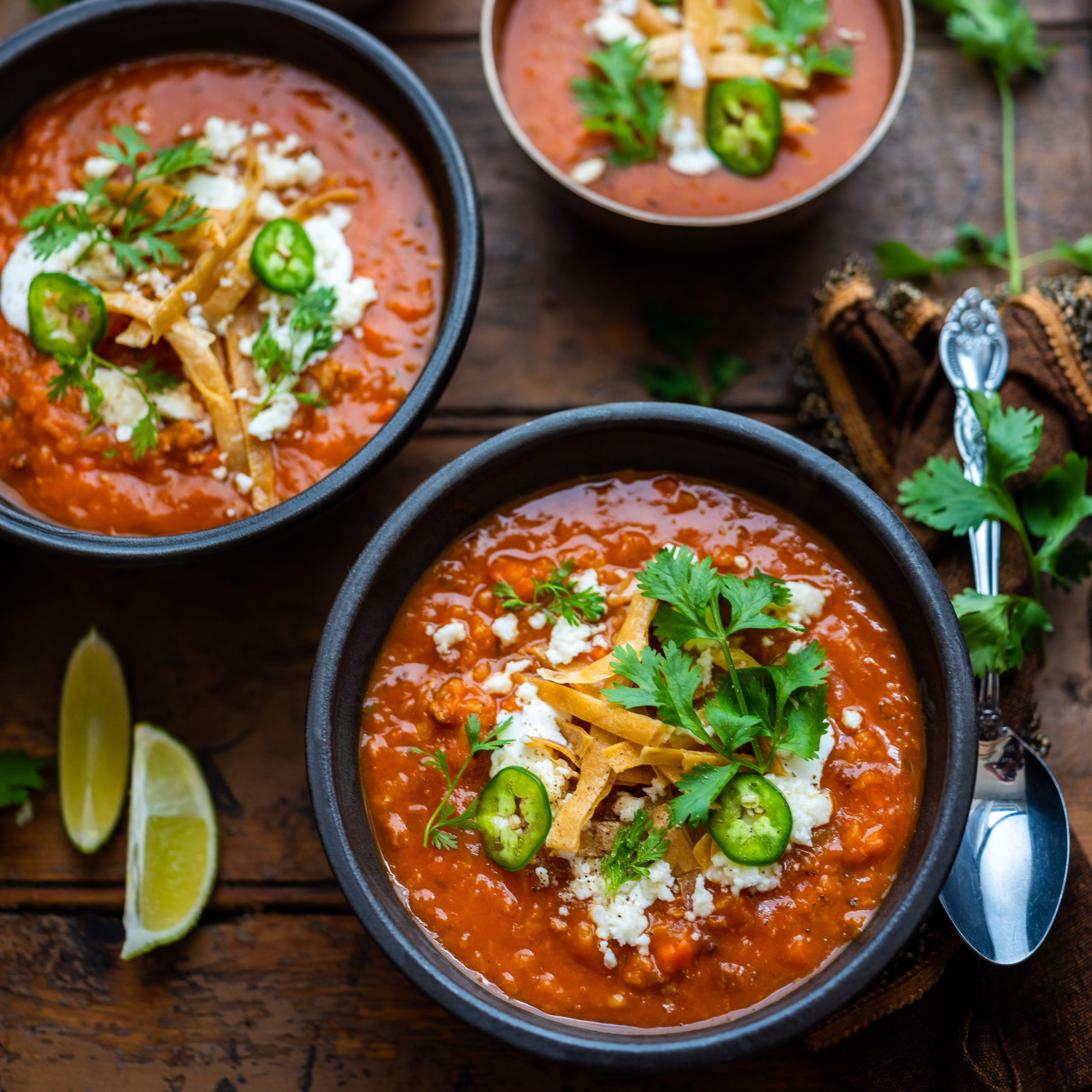 Spicy Lentil & Chorizo Soup with Fried Tortilla Strips | Cacique® Foods